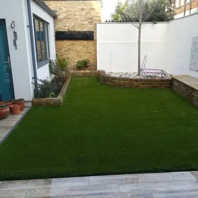 elite grass installed in the back area of house