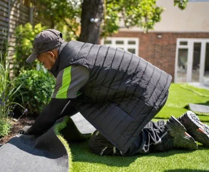 team is working on grass installation_