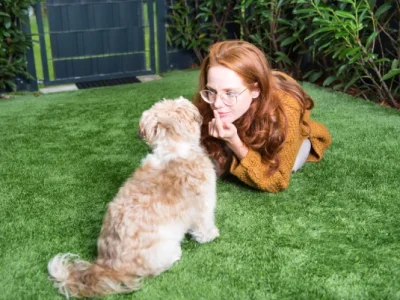 woman is watching her dog